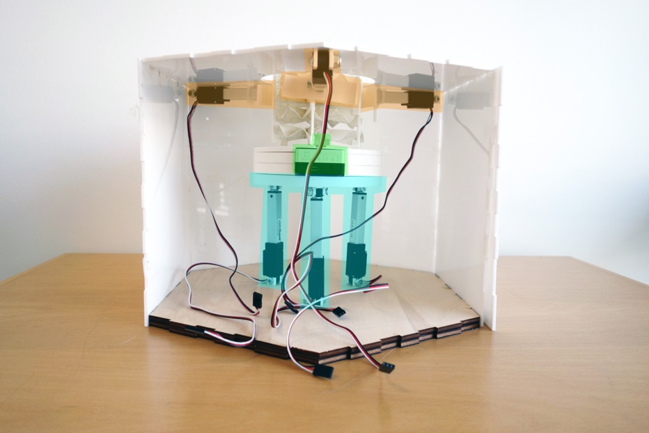 A computer sitting on top of a wooden table
Description automatically generated